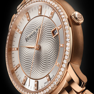The silvery dial fake watch is decorated with diamonds.